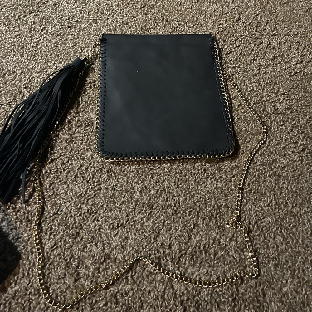 Black crossbody purse with gold strap
